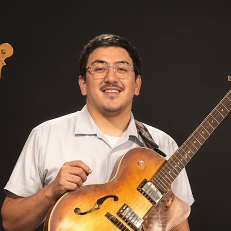 Portrait of Jaime on guitar